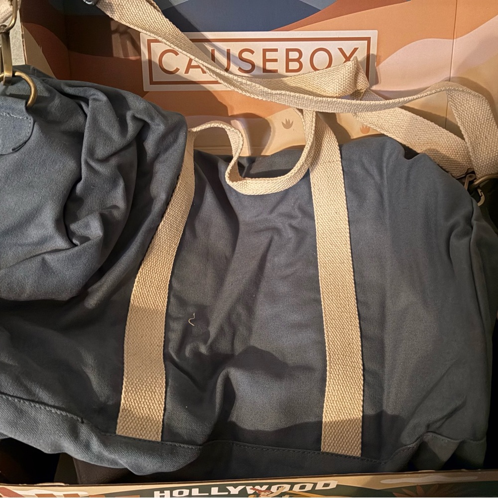 Blue and Cream Travel Bags with Durable Material and Spacious Design